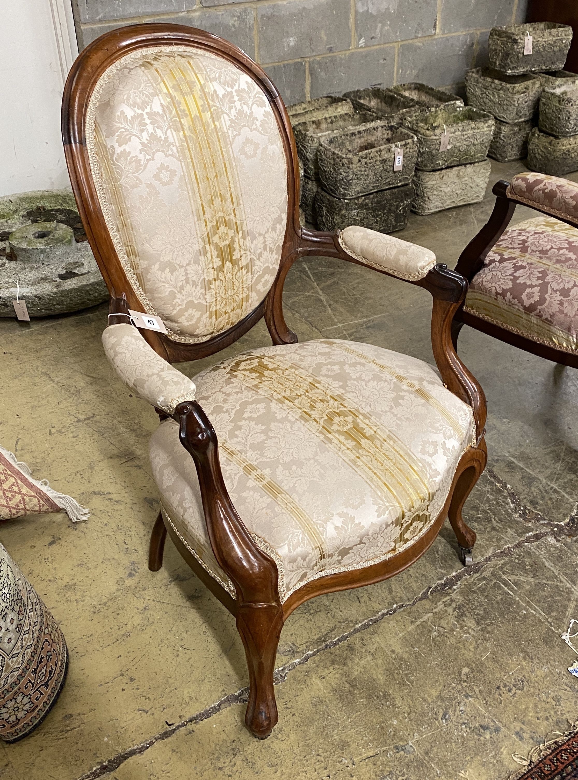 A 19th century French upholstered faded rosewood open armchair, width 62cm, depth 48cm, height 99cm